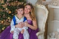 Family scene mom  and kid , Christmas time Royalty Free Stock Photo