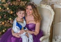 Family scene mom  and kid , Christmas time Royalty Free Stock Photo