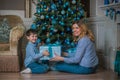 Family scene mom  and kid , Christmas time Royalty Free Stock Photo