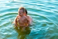 The little boy in his father& x27;s arms, in the waves of the sea. Dad with the little child on vacation. Royalty Free Stock Photo