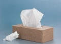 Paper tissue box on blue background Royalty Free Stock Photo