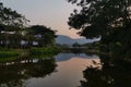 Nice nature resort with slient lake reflect sunset and mountain theme