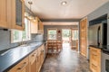 Nice new remodel kitchen with tile floor and blue walls wood cabinetry star decoration Royalty Free Stock Photo