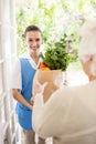 Nice nurse bringing vegetables to old patient Royalty Free Stock Photo