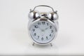 Nice old vintage chrome metal twin bell alarm clock on white background Royalty Free Stock Photo