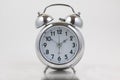 Nice old vintage chrome metal twin bell alarm clock on white background Royalty Free Stock Photo