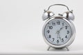 Nice old vintage chrome metal twin bell alarm clock on white background with copy space Royalty Free Stock Photo
