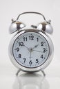 Nice old vintage chrome metal twin bell alarm clock on white background Royalty Free Stock Photo