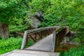 Nice old wooden bridge in park at summertime nature outdoor Royalty Free Stock Photo