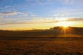 Nice orange winter sunrise on Czech countryside with sunrays Royalty Free Stock Photo