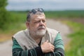 Portrait of bearded Caucasian senior man wearing .black sunglasses on top of the head and looking forward Royalty Free Stock Photo