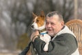 Portrait of Caucasian senior man with his cute basenji dog Royalty Free Stock Photo