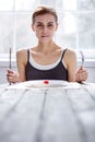 Nice pale woman holding a fork and knife