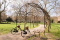 two Bicycles park arched entrance through walk way park. Royalty Free Stock Photo