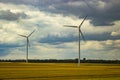 A nice photo of a field with a wind farm