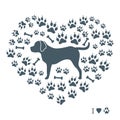 Nice picture of rottweiler silhouette on a background of dog tracks and bones in the form of heart. Royalty Free Stock Photo