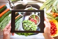 A nice picture with the tablet to show clean vegetables. Healthy food to stay in shape and very welcome to vegan and vegetarian Royalty Free Stock Photo