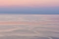 Nice pink sunset seascape in pastel shades, peace and calm outdoor travel background, motion blur