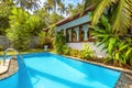 Nice pool in backyard of luxury tropical hotel or residential house Royalty Free Stock Photo