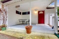 Nice porch with a red door and table set Royalty Free Stock Photo