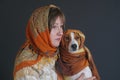 Portrait of beautiful woman with lovely basenji dog both wearing headscarfs