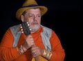 Nice portrait of of a senior musician with mandolin