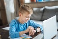 Nice positive boy checking the time Royalty Free Stock Photo