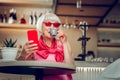 Nice positive senior woman enjoying her coffee