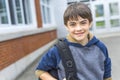 Nice Pre-teen boy outside at school having good time Royalty Free Stock Photo