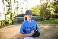 The pre-teen child girl in baseball field