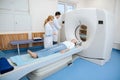 Nice professional doctors using a CT scanner Royalty Free Stock Photo