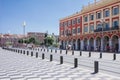 Nice, Provance, Alpes, Cote d`Azur, French, August 15, 2018; A view of the place Massena square with tramway rails, red houses.