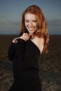 Nice redhead posing on beach Royalty Free Stock Photo