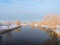 Nice river with smooth water surface and trees in frost Royalty Free Stock Photo