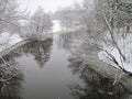 Nice river with smooth water surface and trees in frost Royalty Free Stock Photo