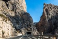 A nice road with tunnels is in the mountains
