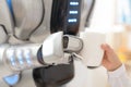Nice robot giving cup of coffee to a girl