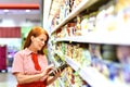 Nice saleswoman in the supermarket - sale of fresh food