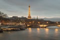 Nice scenery of Eiffel Tower and Seine River in Paris. View from Pont Alexandre III Bridge at sunset Royalty Free Stock Photo