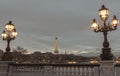 Nice scenery of Eiffel Tower and Seine River in Paris. View from Pont Alexandre III Bridge at sunset Royalty Free Stock Photo