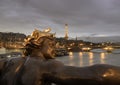 Nice scenery of Golden statue adorning Pont Alexandre III Bridge over the Seine River and Eiffel Tower in Paris at sunset Royalty Free Stock Photo