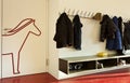 Detail of corridor of modern public school. There are clothes of children outside the classroom Royalty Free Stock Photo