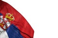 Nice Serbia flag with big folds lie in bottom left corner isolated on white - any holiday flag 3d illustration