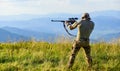 Nice shot. Army forces. Hunter hold rifle. Hunter mountains landscape background. Focus and concentration experienced Royalty Free Stock Photo