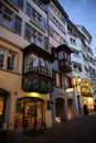 Nice small houses with light illumination in narrow Zurich streets.