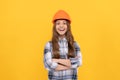 nice smile. building and construction concept. happy child worker wear hardhat.