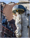 Nice statue at the corner of the facade of some building in Antwerp, Belgium