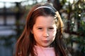 Nice sulky young girl outdoors in park Royalty Free Stock Photo