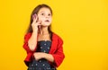 Nice talk. Happy childhood. Small child with smartphone. Cheerful little girl yellow background. Girl kid speak on