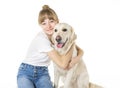 Nice teen woman and her beautiful Golden Retriever dog over white background Royalty Free Stock Photo